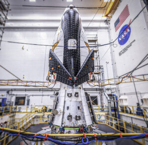 Sierra Space's Dream Chaser mounted on the Team Designed NASA Mechanical Vibration Facility (MVF) table ready for vibration testing